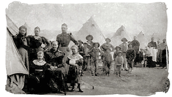 Boer woman and children in a British concentration camp waiting for rations - Anglo Boer War in South Africa