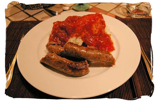 Mieliepap (maize porridge), boerewors (farmer sausage) and sous (sauce) - South African food adventure, South Africa food