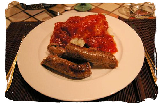 Mieliepap, boerewors en sous” maize porridge, sausage and sauce, a
 favourite with all South Africans - South Africa's Traditional African 
Food