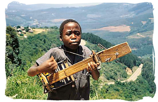 Northern Sotho (BaPedi) youngster playing his homemade guitar - Black People in South Africa, Black Population in South Africa