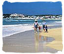 Family enjoying a beach holiday in South Africa