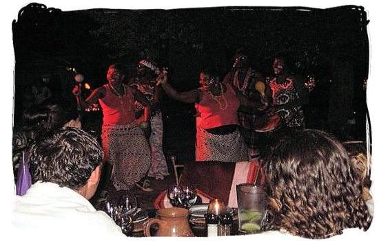 Indigenous african dancers performing in one of the Moyo traditional African restaurants - South Africa's Traditional African Food