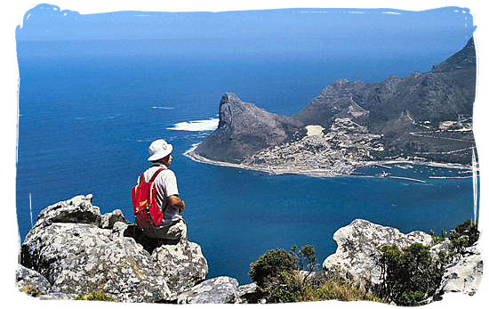 Hiker looking down at Hout Bay in the Cape Peninsula - South Africa Tours, Best Safari Tours of South Africa