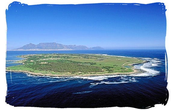 Aerial view of Robben Island with Cape Town and Table Mountain visible in the distance