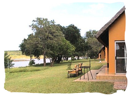 Guest cottages overlooking the dam at Shimuwini bushveld camp, Kruger National Park