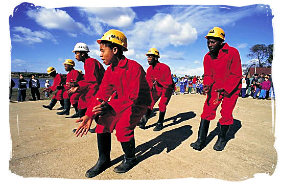 Mine workers performing the popular miners Gumboot Dance - South Africa dance