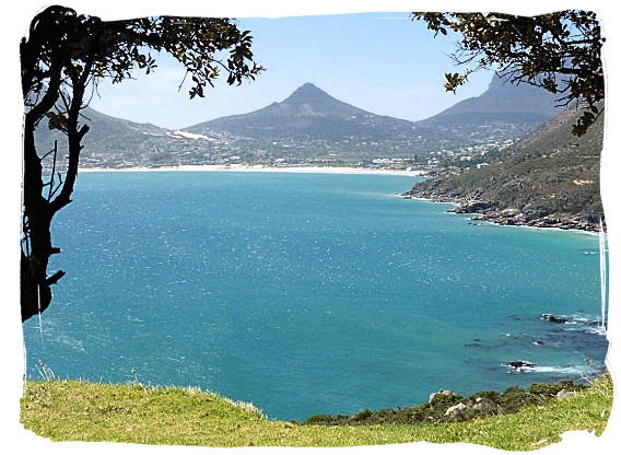 View from Chapman's Peak drive across Hout Bay with the town of Hout Bay visible in the distance