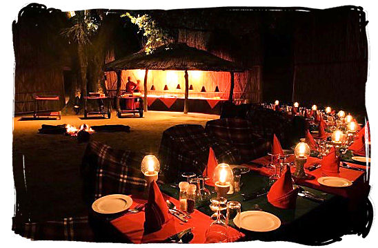 An exquisite bushveld dinner is awaiting in the boma at Mala Mala private game reserve
