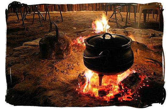 Heating up the potjie - pot food (Potjiekos) in South Africa