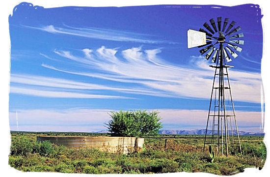 Lonely windmill in the Great Karoo pumping up precious water from underground - The Great Karoo Climate, Karoo National Park South Africa