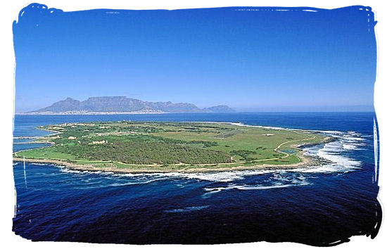 Aerial view of Robben Island with Table Mountain on the horizon - Amazing Robben Island tour, visit Nelson Mandela prison cell