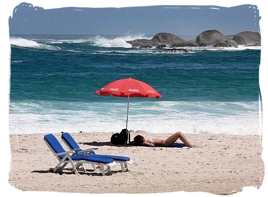 Blissful basking in the sun on Camps Bay's famous beach - Cape Town holiday attractions, Table Mountain National Park