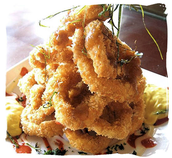 Deep-fried calamari rings - seafood cuisine in South Africa.