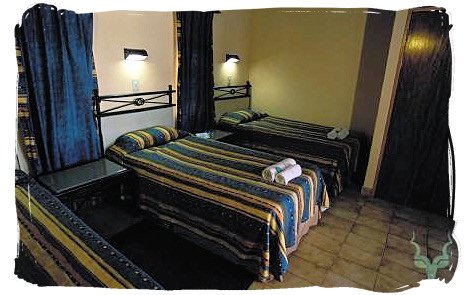Bedroom of a guest cottage at Shimuwini bushveld camp, Kruger National Park