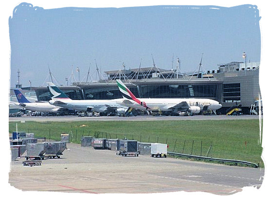Airplane parked at the international arrival and departure terminals at OR Tambo Airport - Cheap Flights to Johannesburg Airport South Africa
