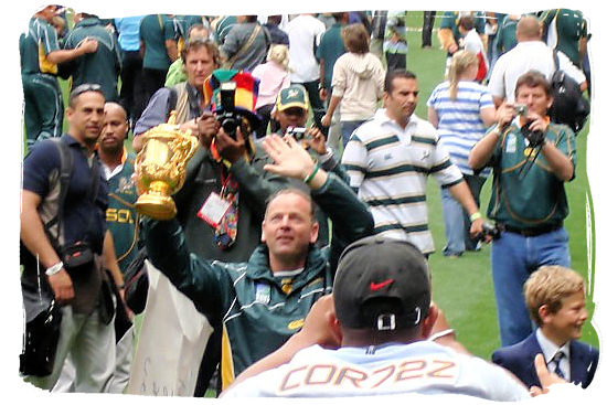 Jake White trainer and coach of the victorious 2007 Springbok team proudly shows the William Webb Ellis world cupTrophy to a sea of Springbok supporters at the Newlands Rugby Stadium in Cape Town - Springbok rugby in South Africa and the South Africa rugby team
