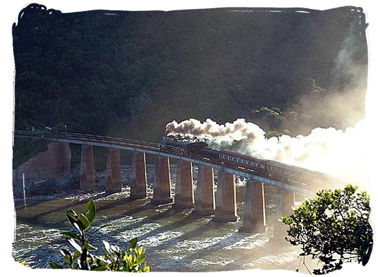 The Outeniqua Choo Tjoe steam train on the Kaaiman’s river bridge near Wilderness