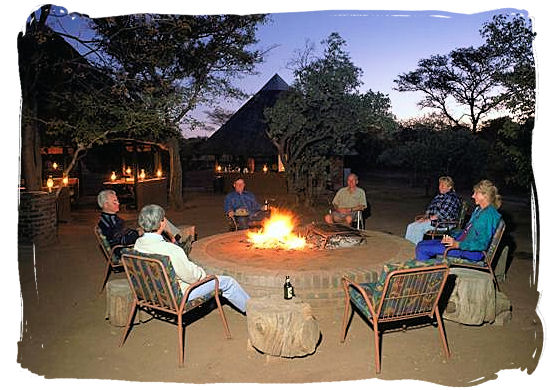 Relaxing around the camp fire - Sirheni Bushveld Camp, Kruger National Park Safari, South Africa