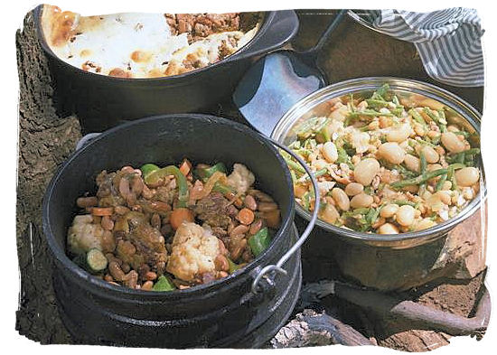 Potjiekos, legacy of the early Dutch settlers, who used to cook stew in a pot over an open fire - South Africa food history and culture