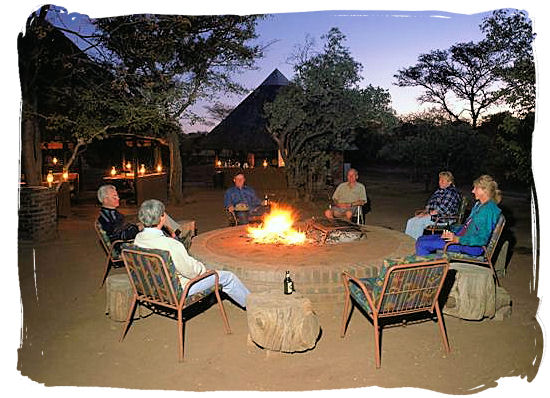Socializing around the barbecue fire before and after the braai (barbecue) is typically South African - South African traditional food