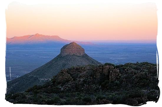 The sun is setting overt Spandou kop (hill) - Camdeboo National Park (previously Karoo Nature Reserve