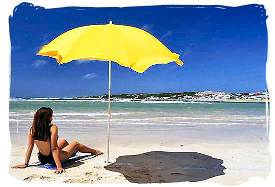 Lazing in the sunshine on one of Cape Town's famous beaches - Cape Town weather forecast, South Africa weather facts