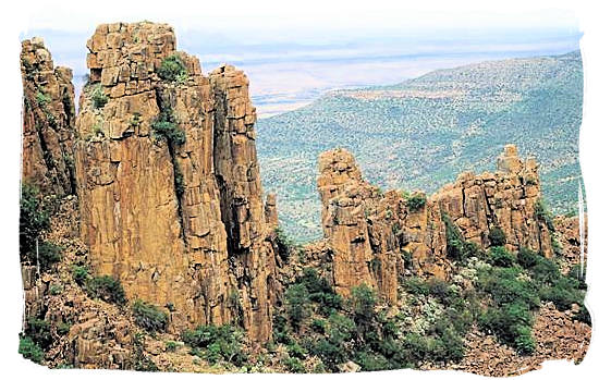 Piled dolerites columns against the backdrop of the “Valley of Desolation - Camdeboo National Park, Karoo Nature Reserve, South Africa