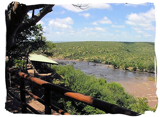 Olifants Restcamp, Kruger National Park, South Africa - View across the river from the perimeter of the camp with shaded lookout on the left