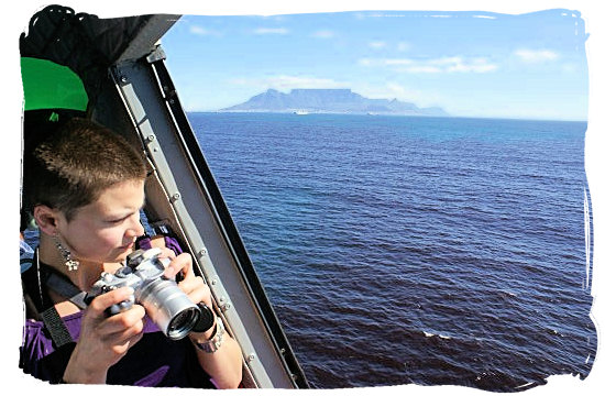 View of Table Mountain on the skyline from the legendary Bell UH-1 Huey helicopter - Activity Attractions in Cape Town South Africa and the Cape Peninsula