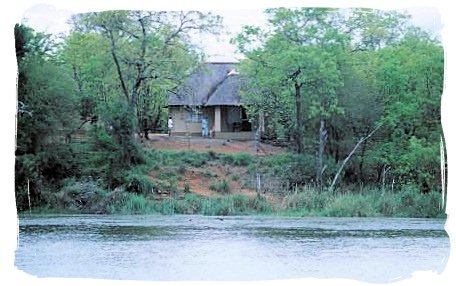 View of the camp from across the dam - Sirheni Bushveld Camp, Kruger National Park Safari, South Africa