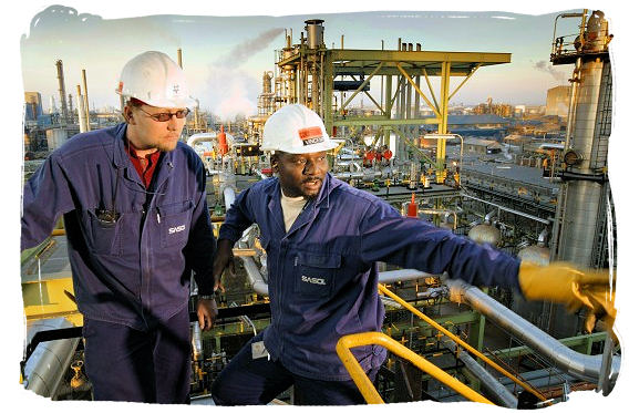 Workers at a Sasol plant in South Africa, the world's largest synthetic fuels producer - South African national anthem